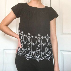 Over the shoulder black and white flowered top